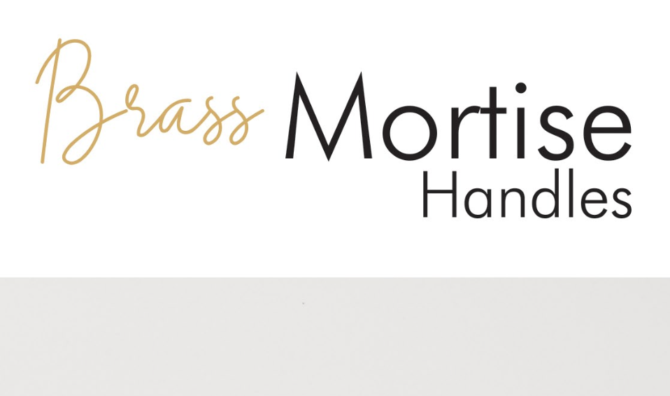 Minimalist home decor items including vases, candles, and artwork arranged on a shelf